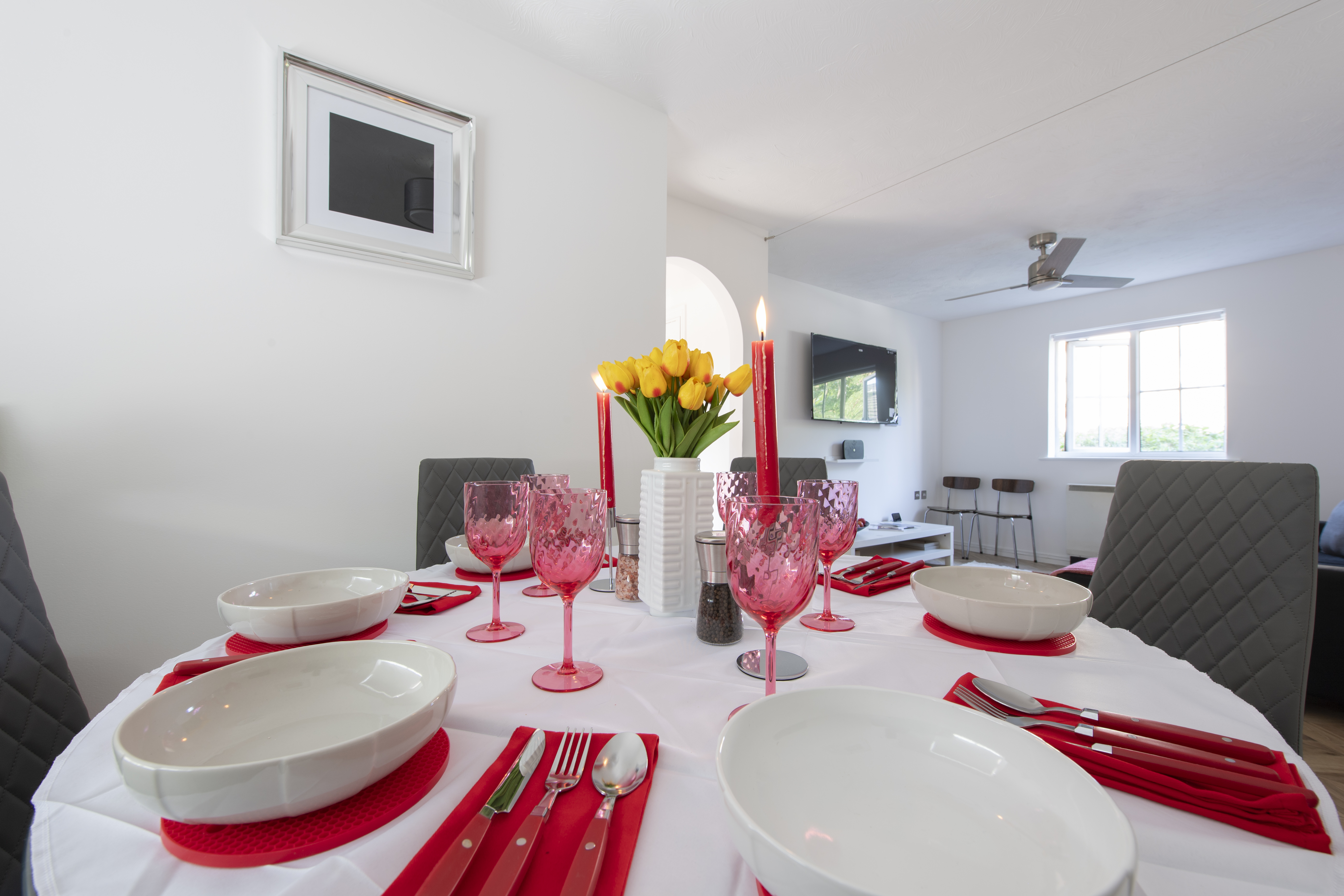 Property two — dining table set for guests