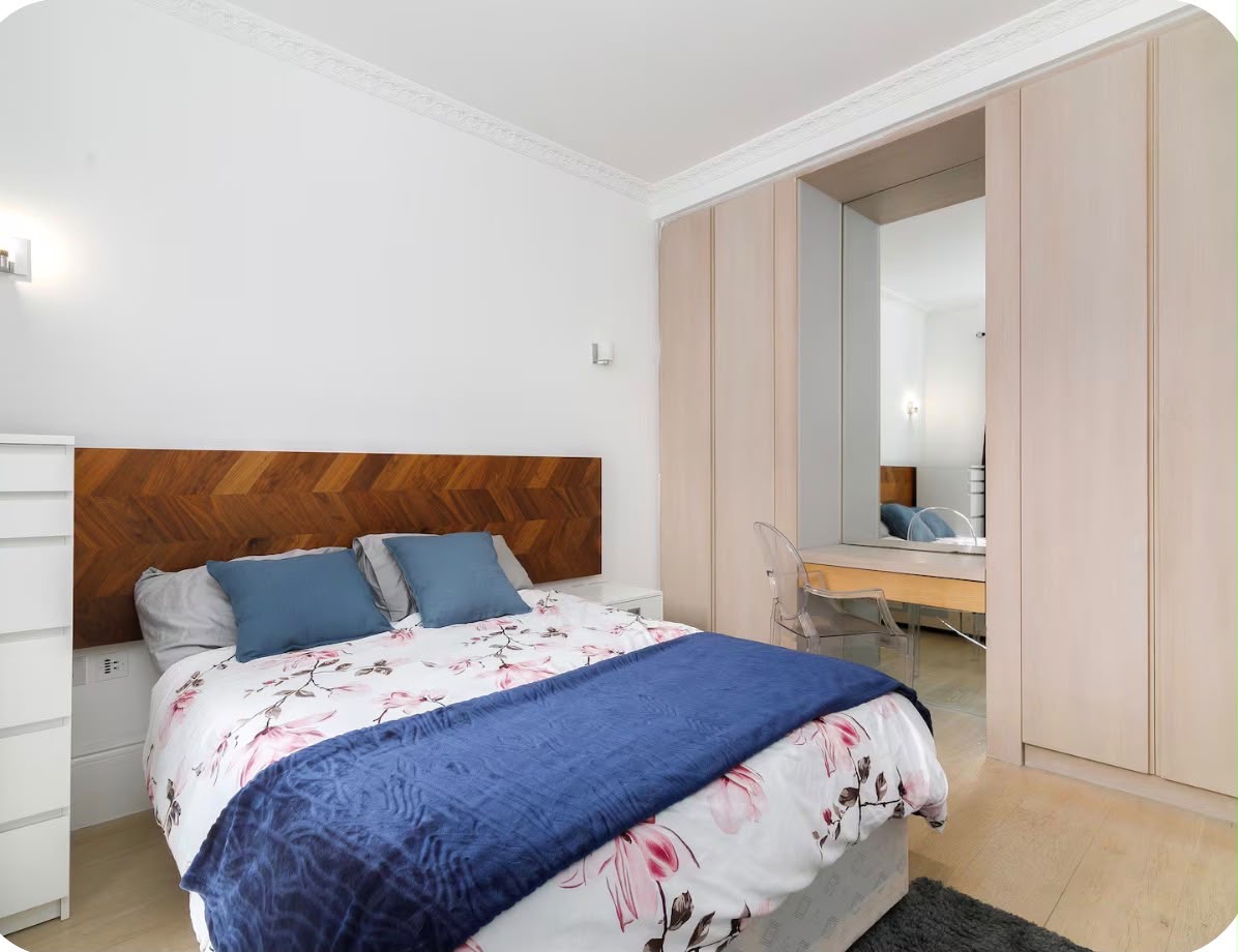 Managed property — bedroom with wood headboard